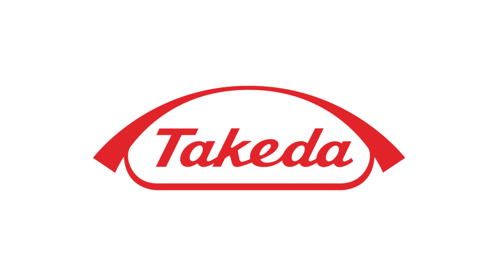 Kuvassa on Takedan logo. Logo on punaisen värinen ja kehyksen sisällä lukee Takeda.